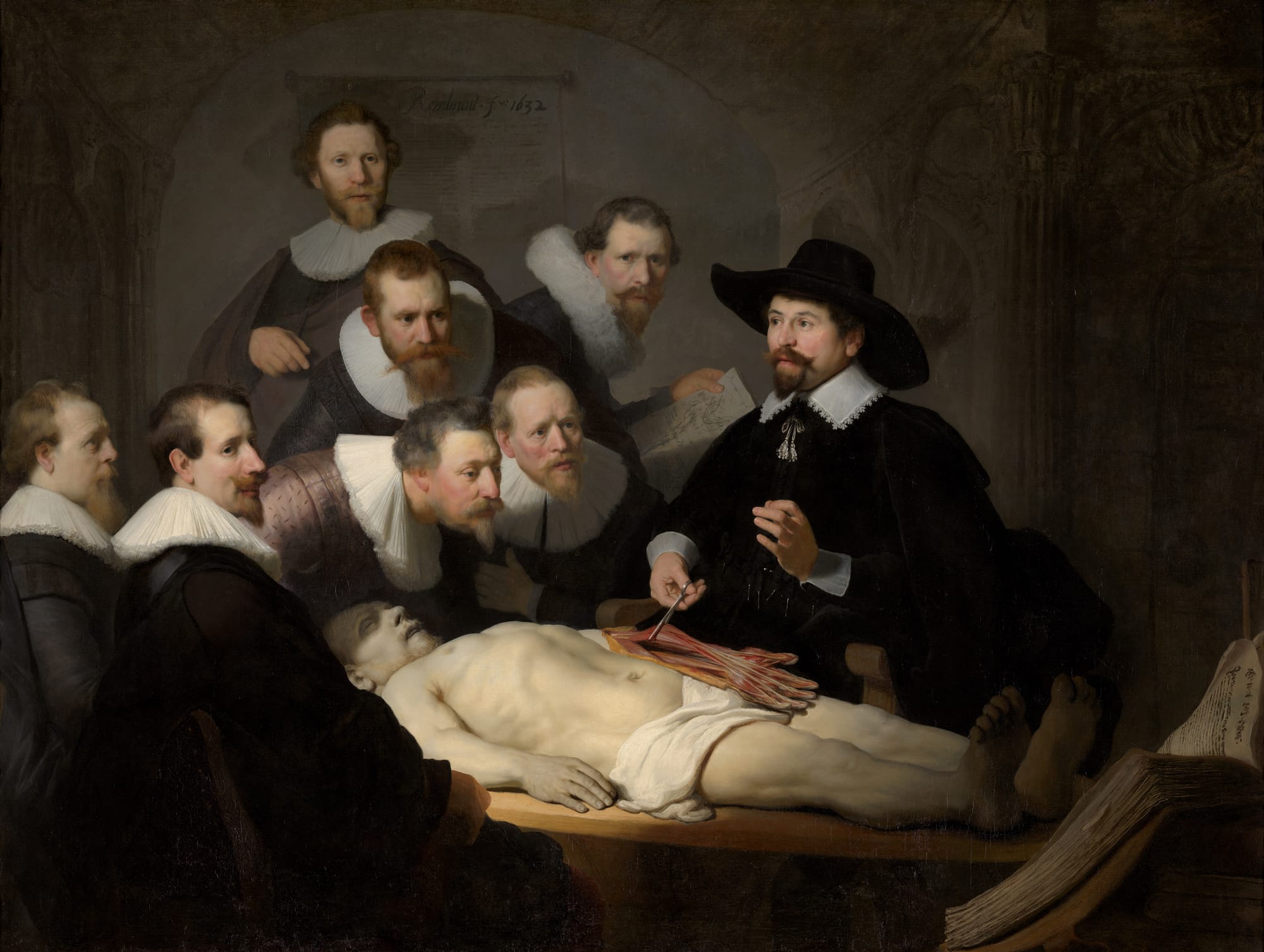 Group portrait showing seven men in 17th-century dress observing a public dissection by a physician holding open a cadaver's forearm