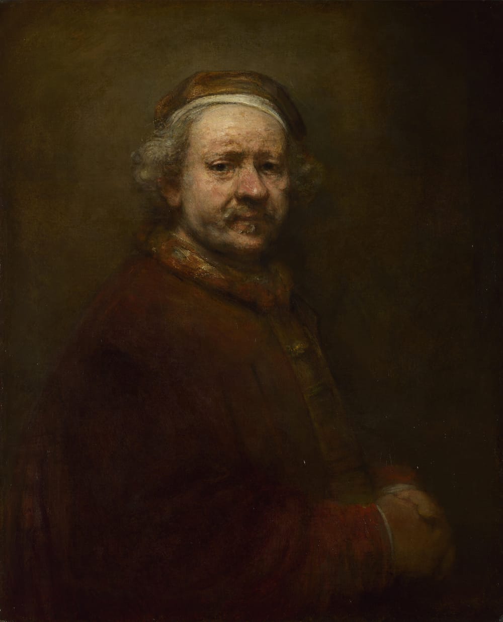 Aged Rembrandt self-portrait from 1669 showing him at 63, dark cap and loose coat, deeply shadowed face with tired eyes